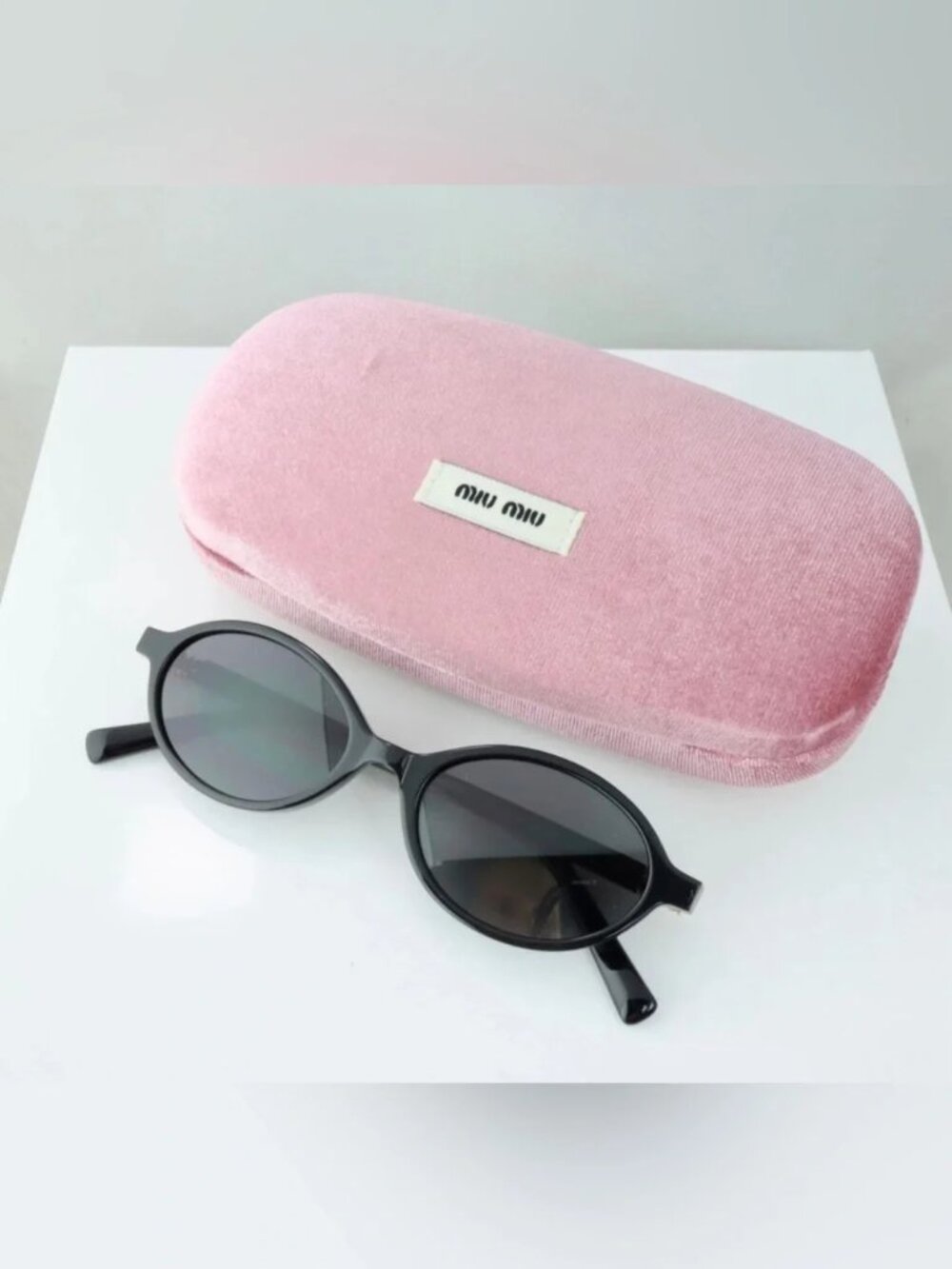 Miu Miu Black Oval Slim Frame Sunglasses